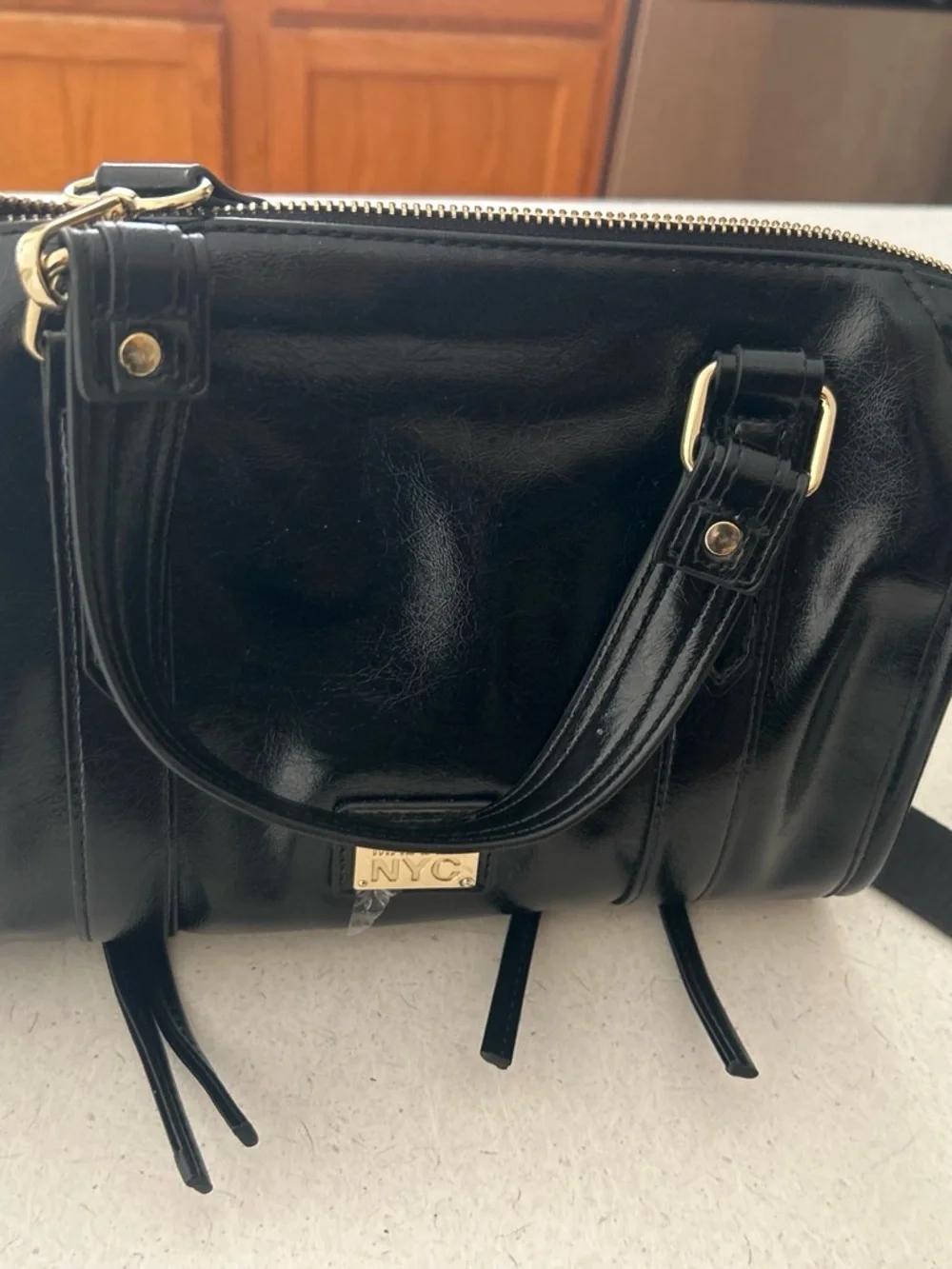 NYC Patent Black Crossbody Bag with Gold Accents